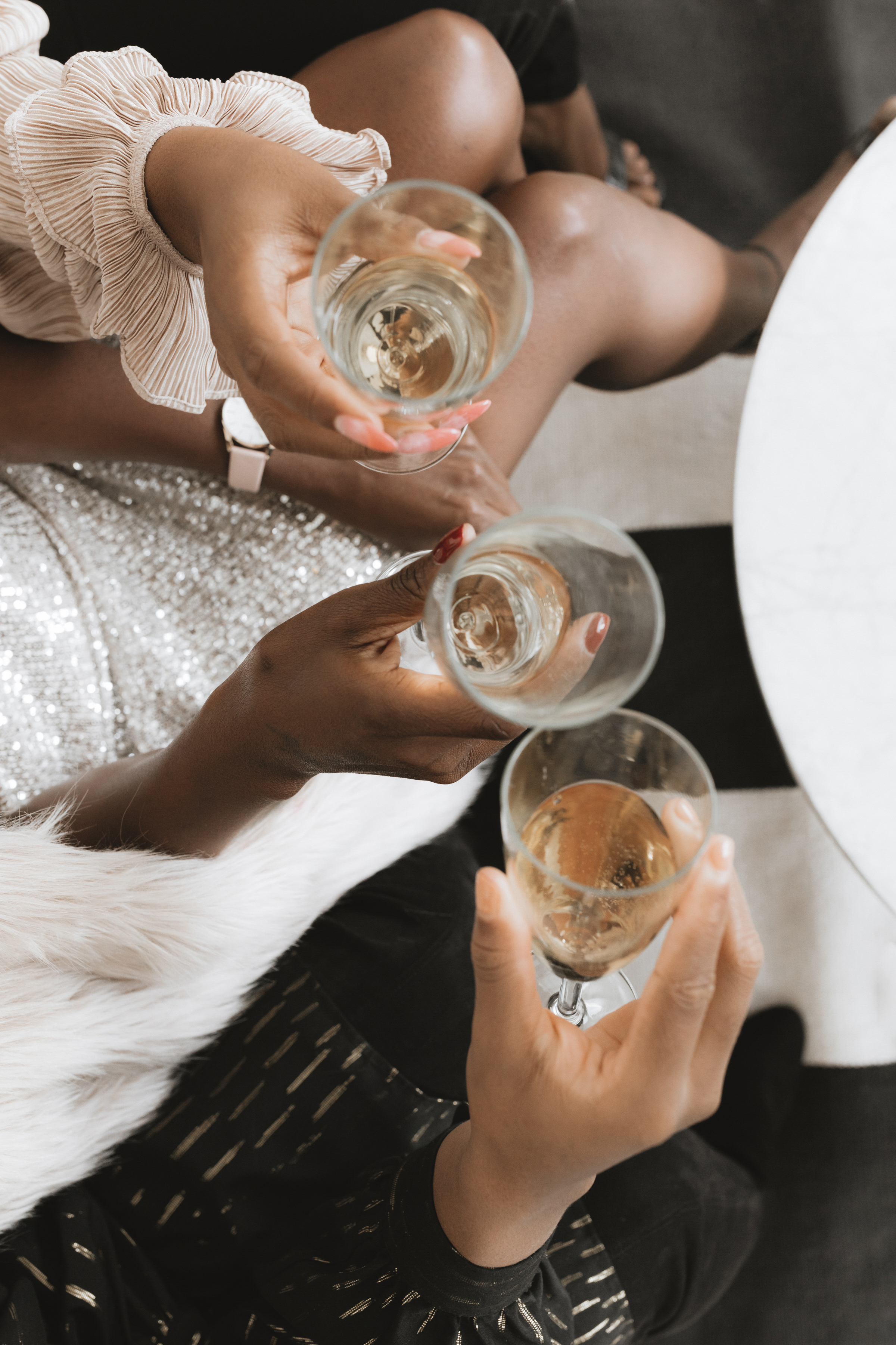 Girls hands holding glasses of champagne